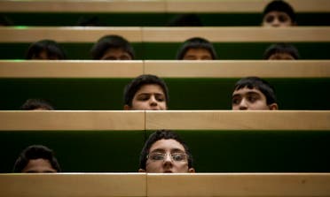 Schoolboys attend a session of the Iranian parliament in Tehran on December 11, 2011. (Reuters)