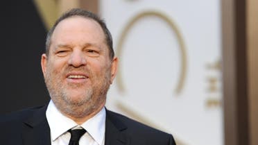 (FILES) This file photo taken on March 2, 2014 shows US film producer Harvey Weinstein arriving on the red carpet for the 86th Academy Awards in Hollywood, California. Harvey Weinstein hired journalists and highly trained ex-spies and military personnel who used fake identities to try to stop accusers from going public with sexual misconduct claims against him, The New Yorker reported on November 6, 2017. The news came as the Television Academy, which hands out Emmy Awards, was said to have expelled Weinstein "for life," following a similar move by the Academy of Motion Picture Arts and Sciences, which gives out the Oscars. (AFP)