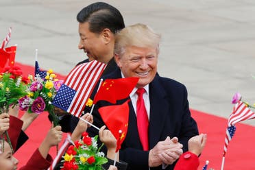 Trump and Xi Jinping greeted by children during a welcome ceremony in Beijing on Nov. 9, 2017. (AP)