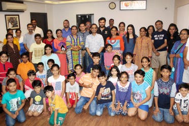 A group of happy parents with their children after the completion of the course at Loving Centre for Transformation. (Supplied)