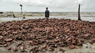 PHOTOS: Shrinking island in India triggers climate refugee crisis