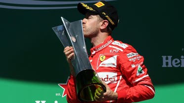 Ferrari’s Sebastian Vettel celebrates winning the Sao Paulo, Brazil Grand Prix race on the podium (Reuters)