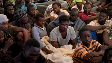 Migrants and refugees sit on the deck of the rescue vessel Golfo Azzurro after being rescued by Spanish NGO Proactiva Open Arms workers in the Mediterranean Sea Friday, June 16, 2017. (AP)