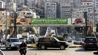 This November 10, 2017 photo shows a banner bearing the images of Saudi King Salman and Crown Prince Mohammed bin Salman on a pedestrian crossing in the Lebanese city of Tripoli. (AFP)
