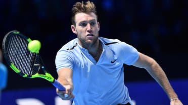 USA's Jack Sock returns against Croatia's Marin Cilic during their men's singles round-robin match on day three of the ATP World Tour Finals tennis tournament at the O2 Arena in London on November 14, 2017.  Glyn KIRK / AFP