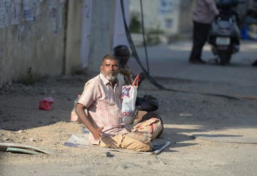An Indian man begs on the side of the road in Hyderabad on November 10, 2017. (AFP)