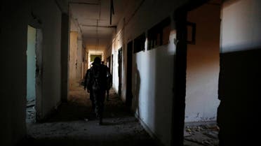 Fighters of Syrian Democratic Forces inspect the bunker of the Islamic State militants under the stadium in Raqqa, Syria October 18, 2017. Picture taken October 18, 2017. REUTERS/Erik De Castro
