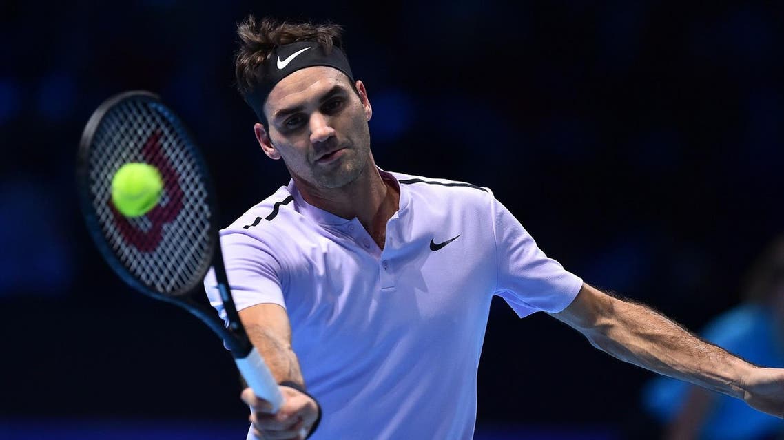 Switzerland's Roger Federer returns against Germany's Alexander Zverev during their men's singles round-robin match on day three of the ATP World Tour Finals tennis tournament at the O2 Arena in London on November 14, 2017. (AFP)