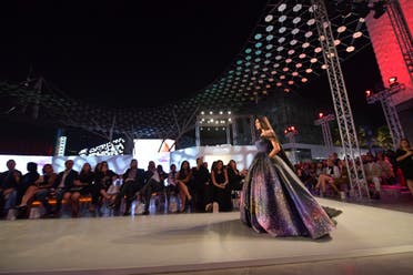 A model presents on the catwalk a creation of Aiisha Ramadan during the Arab Fashion Week in Dubai on November 15, 2017. (AFP)