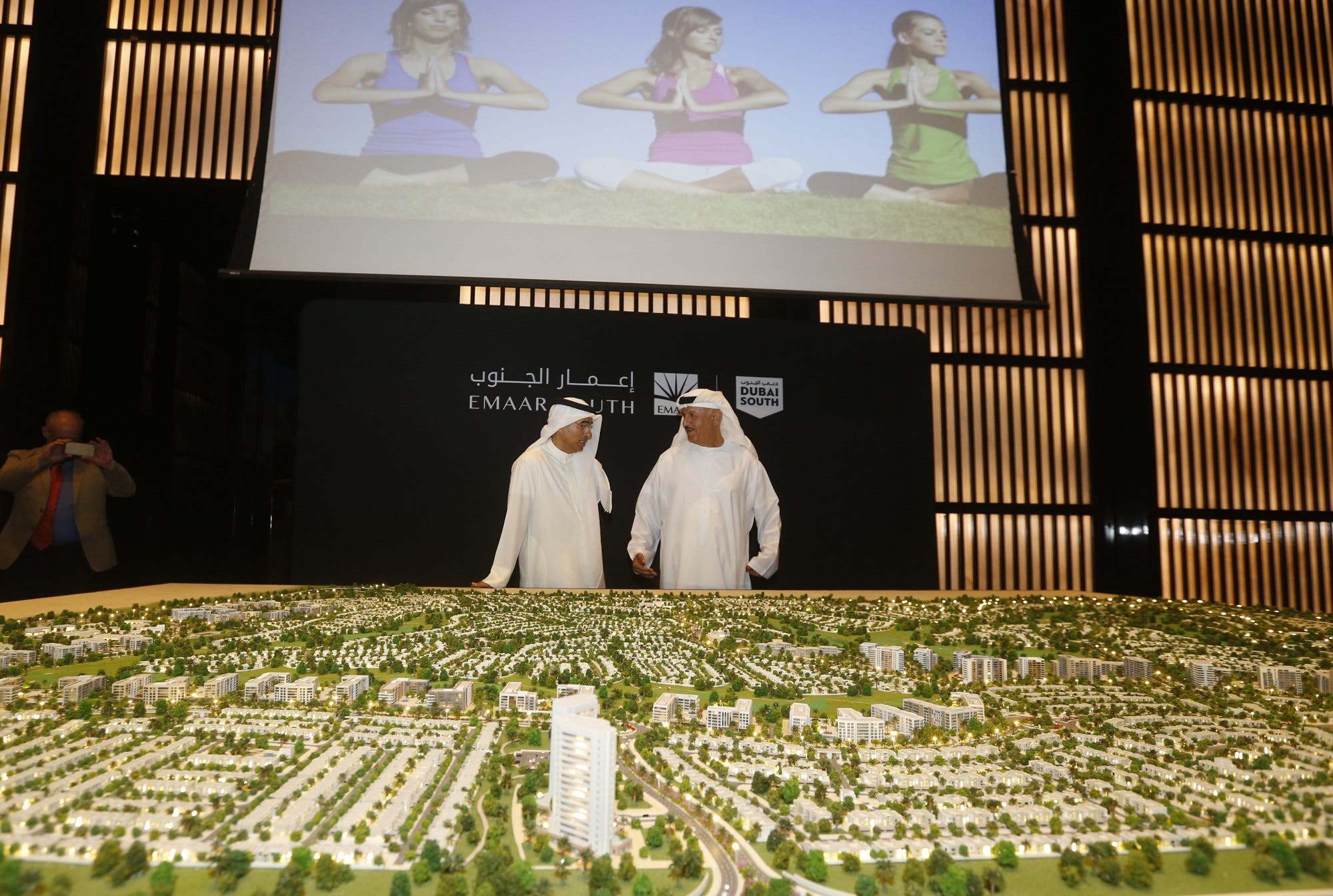 Now-former Chairman of Dubai Emaar Properties Mohamed Alabbar (L) during the unveiling of the plans for the construction of the new “Emaar South” development in Dubai on September 5, 2016. (AFP)