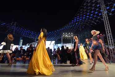 Models present on the catwalk creations of Aiisha Ramadan during the Arab Fashion Week in the United Arab Emirate of Dubai on November 15, 2017. (AFP)