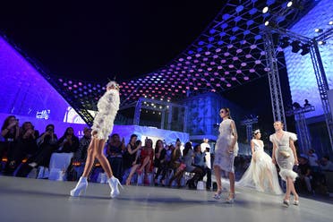 Models present creations by Amato during the Arab Fashion Week in the United Arab Emirate of Dubai on November 15, 2017. (AFP)