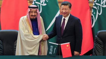 President Xi Jinping (R) and King Salman shake hands during a signing ceremony at the Great Hall of the People in Beijing on March 16, 2017. (Reuters)