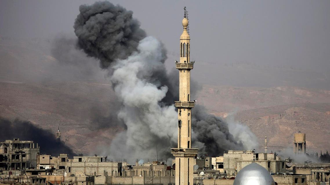 Smoke rises following an air strike on the rebel-held besieged town of Arbin, in the Eastern Ghouta region on the outskirts of Damascus, on November 18, 2017. (AFP)