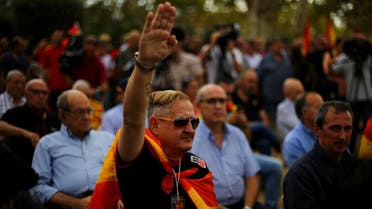 An ultra right wing demonstrator salutes during Spain’s National Day in Barcelona on October 12, 2017. (Reuters)