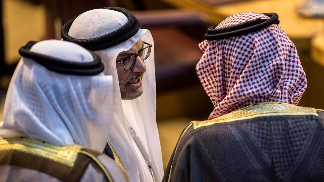 Saudi Foreign Minister Adel al-Jubeir (R) talks with UAE Minister of State for Foreign Affairs Anwar Gargash (C) during a meeting at the Arab League headquarters in the Egyptian capital Cairo on November 19, 2017. (AFP)