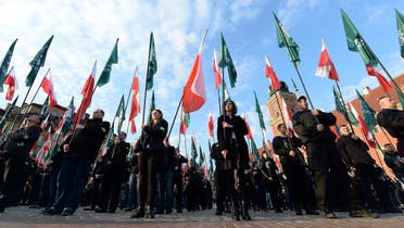 This April 29, 2017 photo shows members of the far-right group, the National-Radical Camp, marking 83rd anniversary of their organization, in Warsaw. (AP)