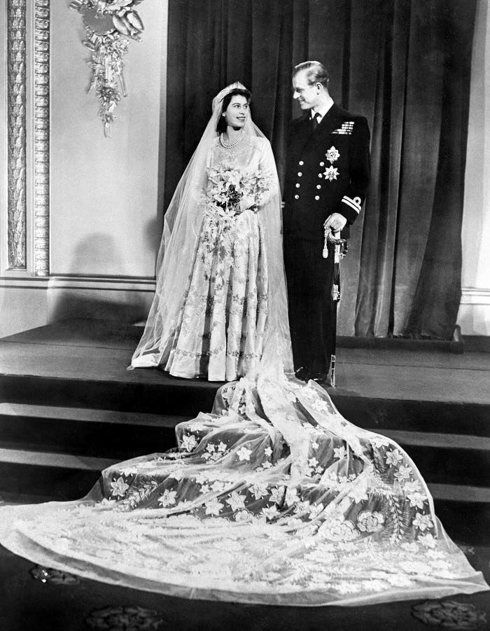 Princess Elizabeth (future Queen Elizabeth II) and Philip Duke of Edinburgh pose on their wedding day, 20 November 1947 in Buckingham Palace. (AFP)