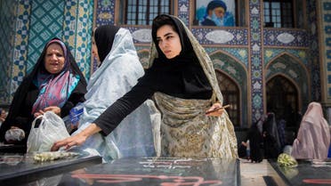 Women pray for unknown Iranian soldiers who were killed during the 1980-1988 Iran-Iraq war at the Imamzadeh Saleh holy shrine in Tehran on August 2, 2017. (Reuters)