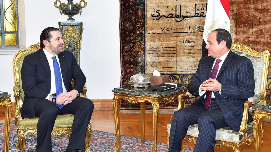 A handout picture released by the Egyptian Presidency shows Egyptian President Abdel Fattah al-Sisi (R) meeting with Lebanese Prime Minister Saad Hariri at the presidential palace in Cairo on March 22, 2017. Handout / EGYPTIAN PRESIDENCY / AFP