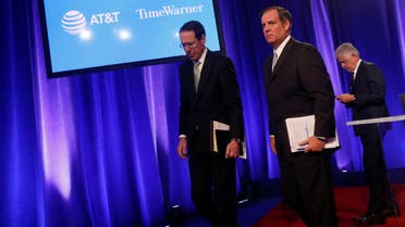 CEO of AT&T Randall Stephenson (L) with David McAtee (C), SEVP and General Counsel for AT&T, in New York City on November 20, 2017. (Reuters)
