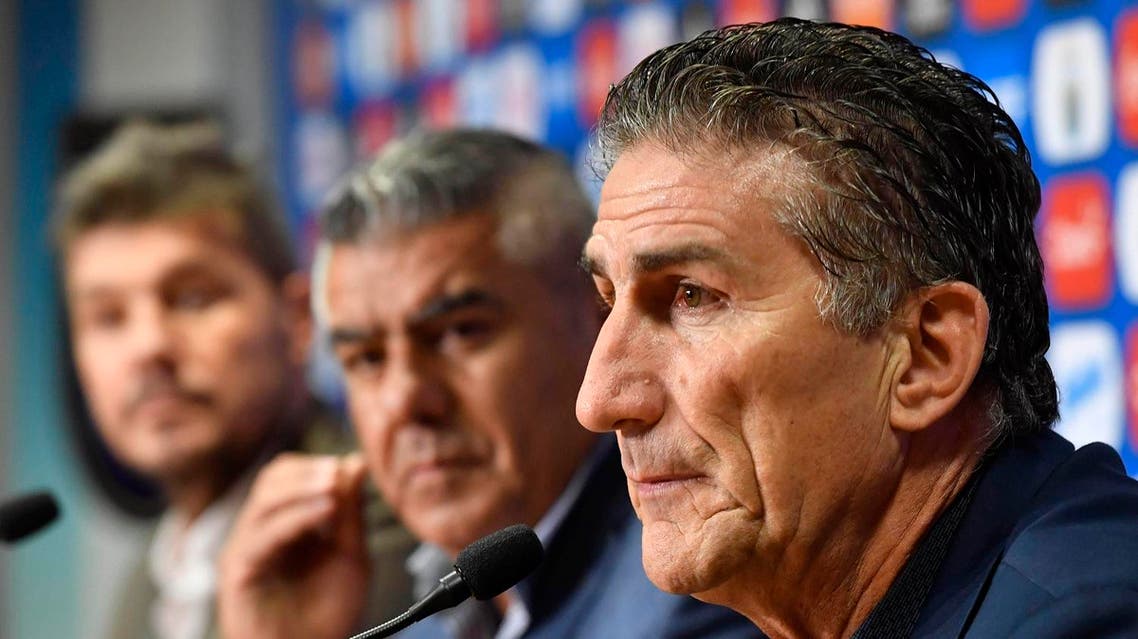 The former coach of Argentina' national football team, Edgardo Bauza (R), takes part in a press conference formalizing his dismissal, alongside the president of Argentina's football association (AFA), Claudio Tapia (C), and Marcelo Tinelli (L), AFA head of Argentina's national teams committee, in Buenos Aires on April 11, 2017. Argentina's football association fired Edgardo Bauza as coach of the crisis-hit national team as it struggles to qualify for next year's World Cup. Alejandro SANTA CRUZ / TELAM / AFP