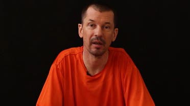 An image grab taken from a video released by the Islamic State (IS) group through Al-Furqan Media via YouTube on September 18, 2014, allegedly shows British freelance photojournalist, John Cantlie, at an undisclosed location in which he says he is being held captive. In the video, Cantlie, wearing an orange jumpsuit, speaks directly to the camera in the style of a news report and promises to reveal the "truth" about the jihadist group that has seized parts of Iraq and Syria. AFP