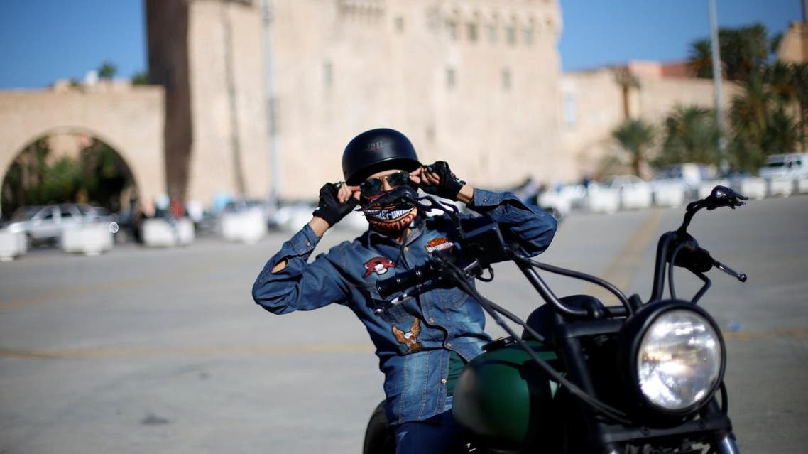 A member of Tripoli bikers group rides his motorbike at the Martyr square in Tripoli. (Reuters)