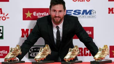 Lionel Messi poses with his four Golden Boot trophies during a ceremony in Barcelona, Spain, on November 24, 2017. (Reuters)