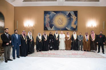 This handout picture released by the Vatican press office shows Pope Francis (C) posing with the delegation of Abdullah bin Fahad Allaidan at the Vatican on November 22, 2017. (AFP)