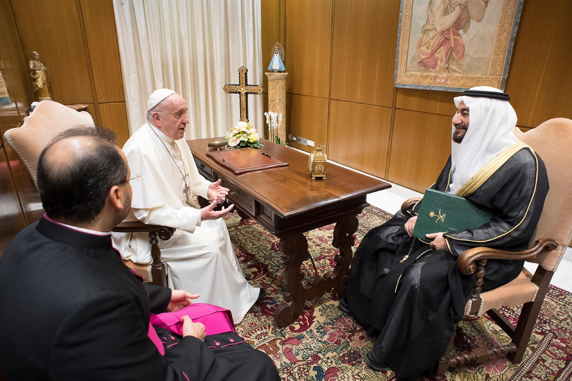 This handout picture released by the Vatican press office shows Pope Francis (L) during an audience with Abdullah bin Fahd al-Luhaidan on November 22, 2017 at the Vatican. (AFP)