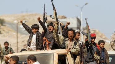 Newly recruited Houthi fighters gesture in Sanaa as they ride a car before heading to the frontline on November 16, 2017. (Reuters)