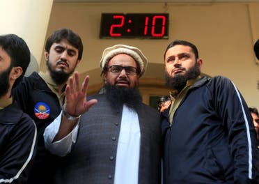 Hafiz Saeed speaks with supporters after attending Friday Prayers in Lahore, Pakistan November 24, 2017. (Reuters)
