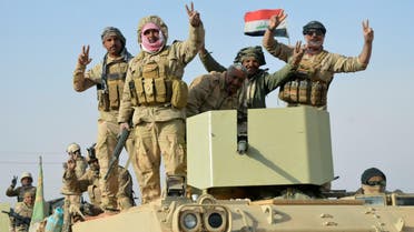 Iraqi security forces after taking control of the border town of Rawa, the last town under the control of the ISIS in Iraq on November 17, 2017. (Reuters)