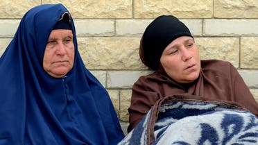 Relatives of the victims of the bomb and gun assault on the North Sinai Rawda mosque sit outside the Suez Canal University hospital in the eastern port city of Ismailia on November 25, 2017