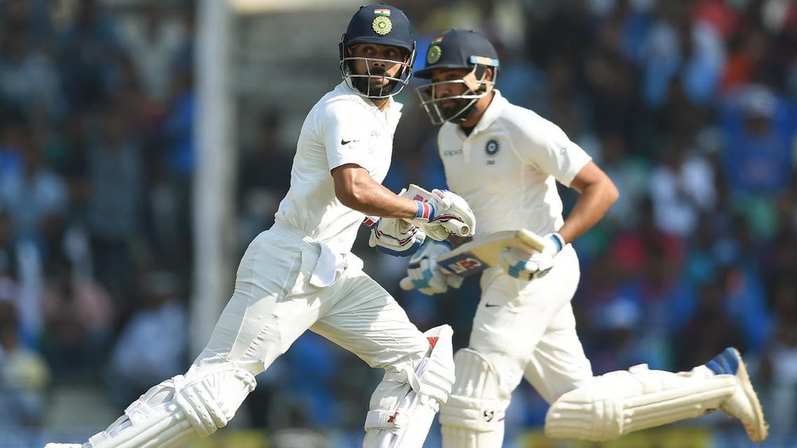 Indian cricketers Virat Kohli (left) and Rohit Sharma run between the wickets on the third day of the second Test cricket match against Sri Lanka in Nagpur on November 26, 2017. (AFP)