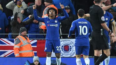 Chelsea's Brazilian midfielder Willian (C) celebrates after scoring their first goal during the English Premier League football match between Liverpool and Chelsea at Anfield in Liverpool, north west England on November 25, 2017.  Paul ELLIS / AFP