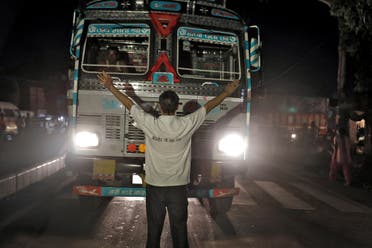 Pawan Pandit, a cow vigilante, stops a lorry at a road block near Chandigarh, India, July 6, 2017. (Reuters)