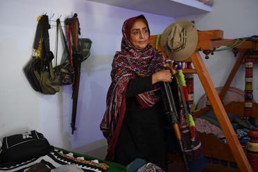 As 200 armed men surrounded their house on a hot August night in 2005, Nazo Dharejo and her sisters grabbed their Kalashnikov and puny stock of ammunition and climbed to the roof. (AFP)
