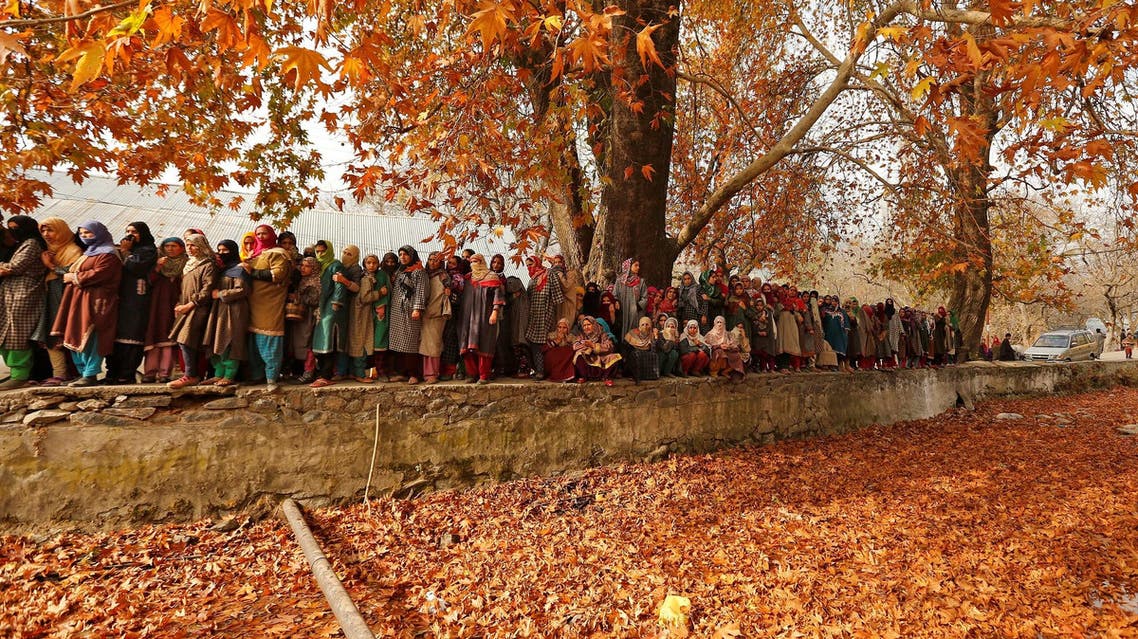 Women watch funeral procession of a suspected militant who was killed by Indian security forces in Kashmir’s Tral town on November 21, 2017. (Reuters)