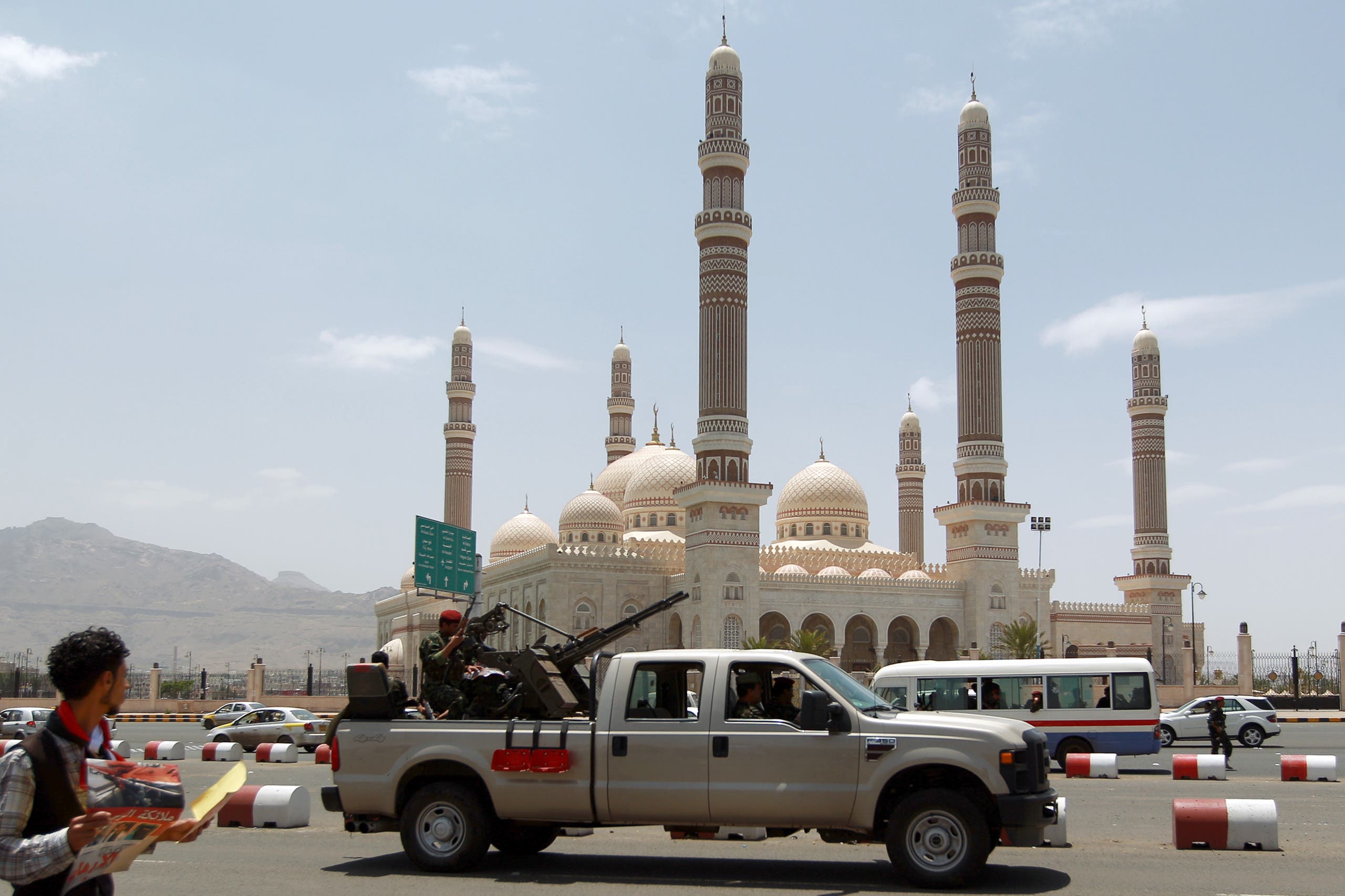 A Yemeni Army vehicle patrols past the al-Saleh mosque in the capital Sanaa on May 21, 2014. AFP