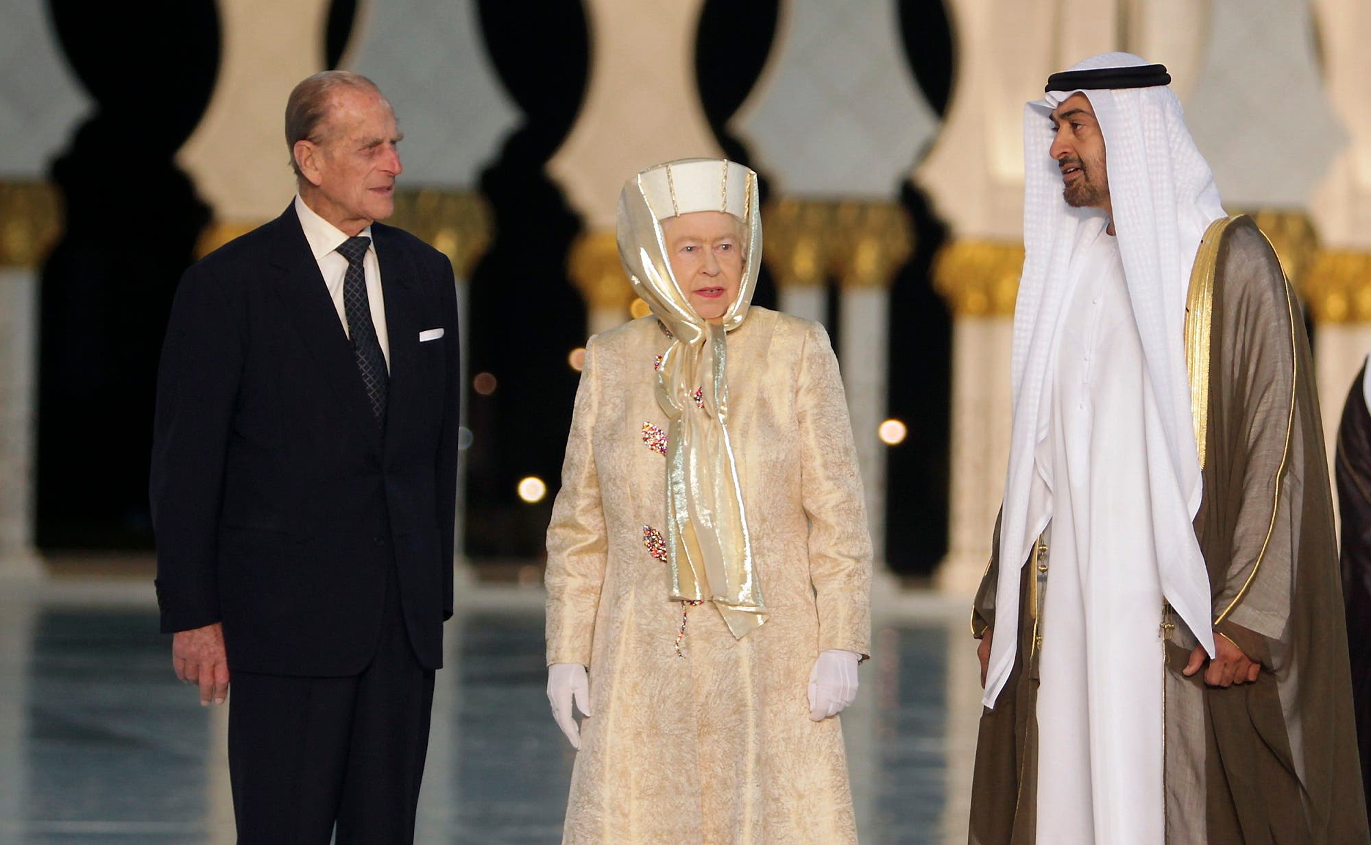Britain’s Queen Elizabeth and her husband Prince Philip stand next to Abu Dhabi’s Crown Prince Sheikh Mohammed bin Zayed during their visit at the Sheikh Zayed Grand Mosque in Abu Dhabi November 24, 2010. (Reuters)