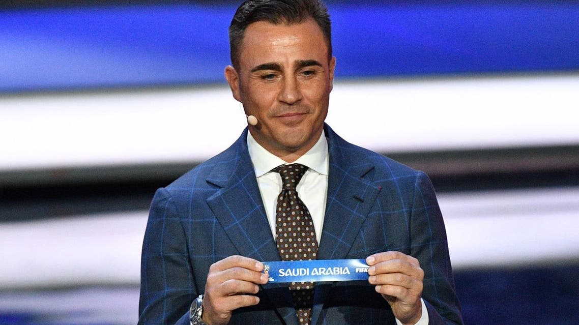 Italy's former defender and Guangzhou Evergrande's coach Fabio Cannavaro displays the slip of Saudi Arabia during the Final Draw for the 2018 FIFA World Cup. (AFP)
