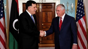 US Secretary of State Rex Tillerson and Libyan Prime Minister Fayez al-Sarraj (left) shake hands after a meeting in Washington, on December 1, 2017. (Reuters)