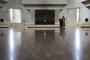 A volunteer reads names during the annual Names Reading ceremony to commemorate those who perished in the Holocaust, in the Hall of Remembrance at the United States Holocaust Memorial Museum, May 2, 2016, in Washington, DC. (AFP)