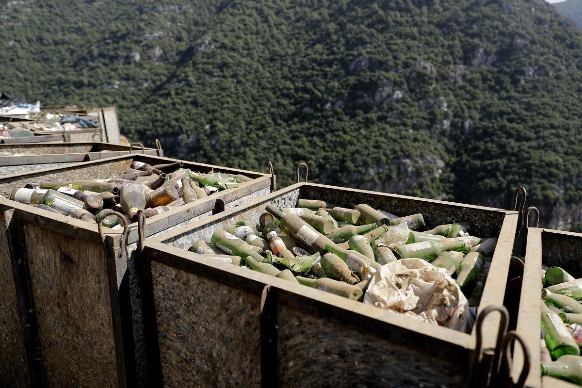 Boxes of glass bottles are seen at a waste treatment plant in the area of Monteverde east of Beirut on October 27, 2017. (AFP)