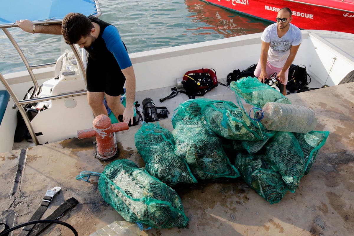The group is conducting a clean-up below the waves, one of many initiatives emerging from Lebanon's civil society and private sector in response to the government's failure to address a long-running garbage crisis. (AFP)