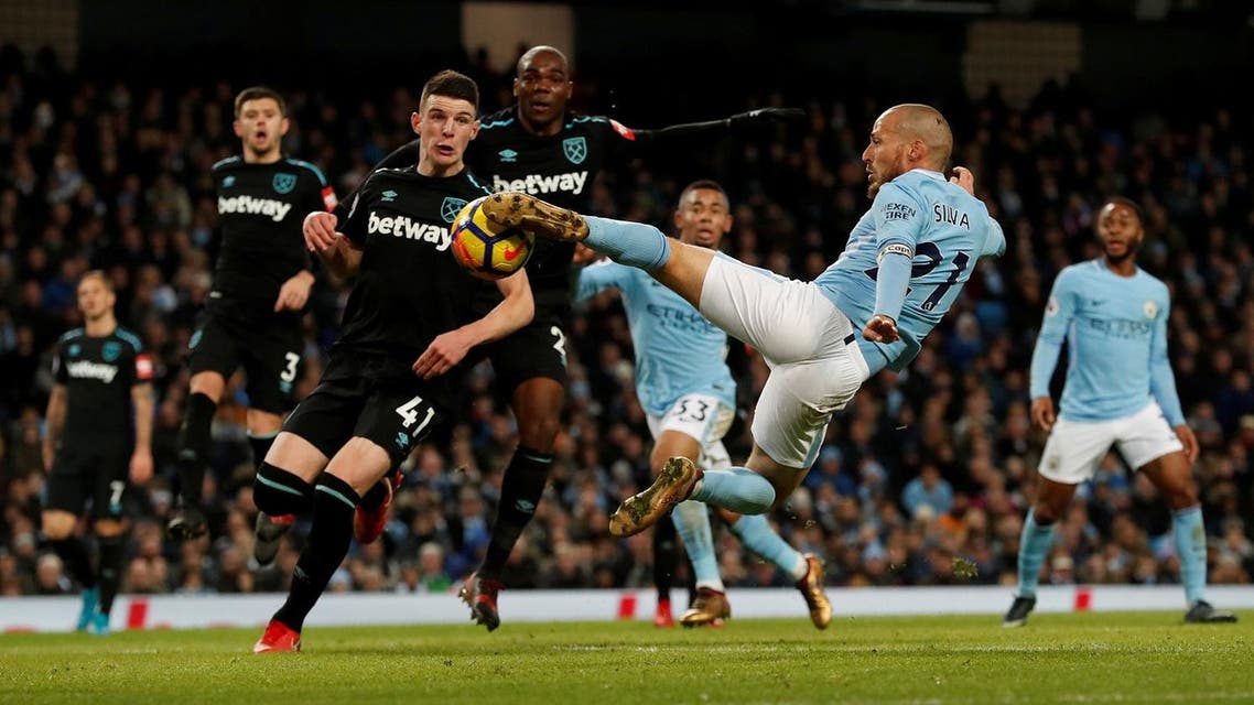 Manchester City’s David Silva scores their second goal against against West Ham. (Reuters)