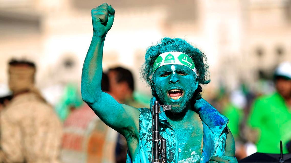 A Muslim Yemeni, covered with green paint, chants slogans as he attends a rally in the capital Sanaa on the occasion of the Prophet Mohammed's birthday on November 30, 2017. (AFP)