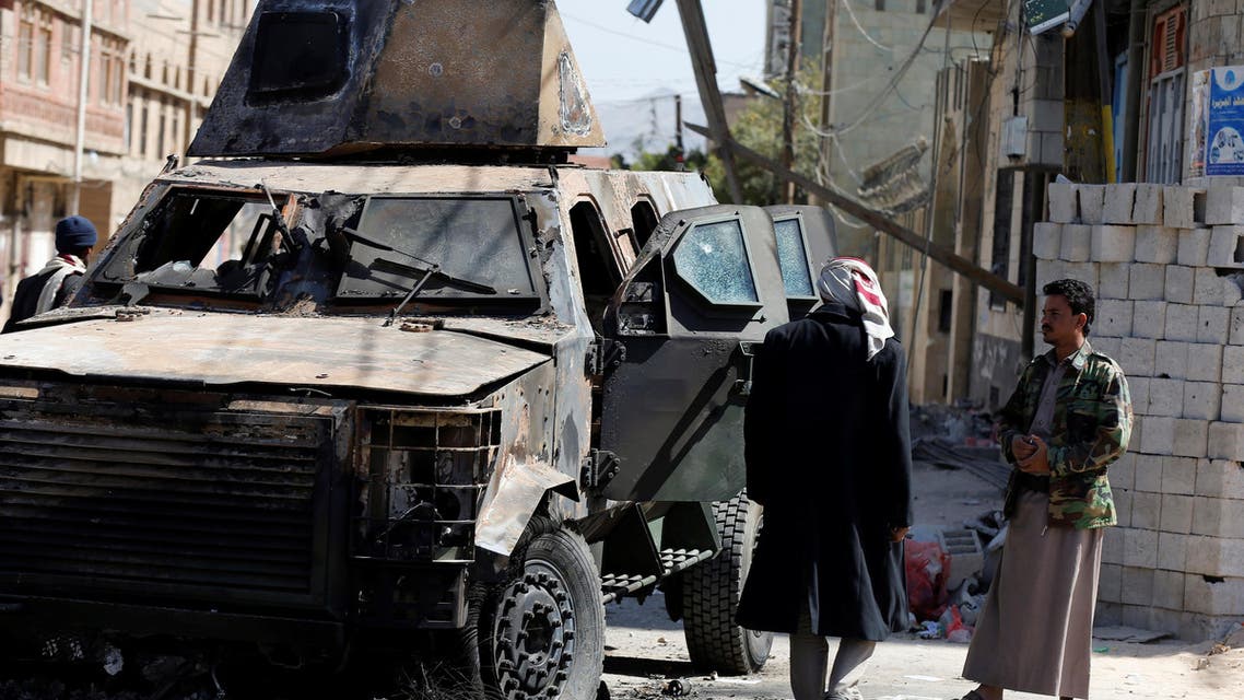 People look at an armored personnel carrier damaged during recent clashes between Houthi fighters and forces loyal to Yemen's former president Ali Abdullah Saleh in Sanaa, Yemen December 5, 2017. (Reuters)